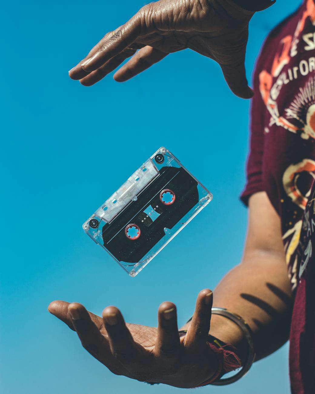 person doing tricks on cassette tape